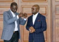 Raymond Omollo with William Ruto